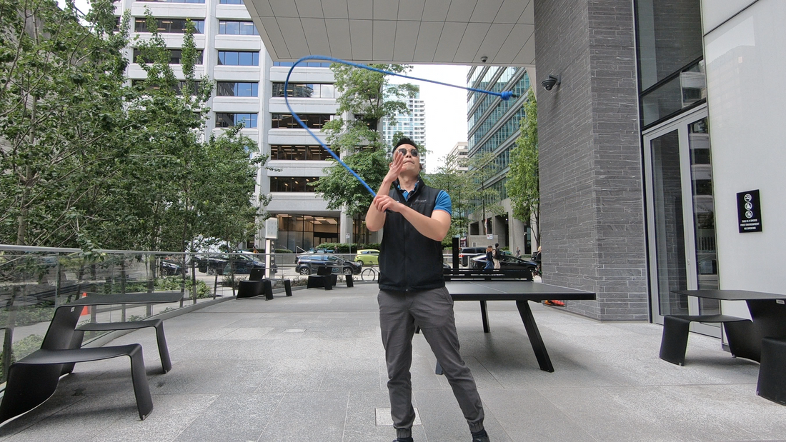 Rope flow practitioner moving a flow rope in continuous patterns