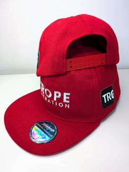 Red flat brim snap back cap with the words the rope generation